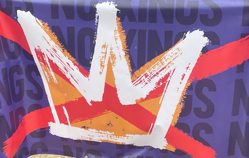 Picture of poster in Philadelphia with the official symbol of the No Kings protest. Crown with an X through it and the words “No Kings”