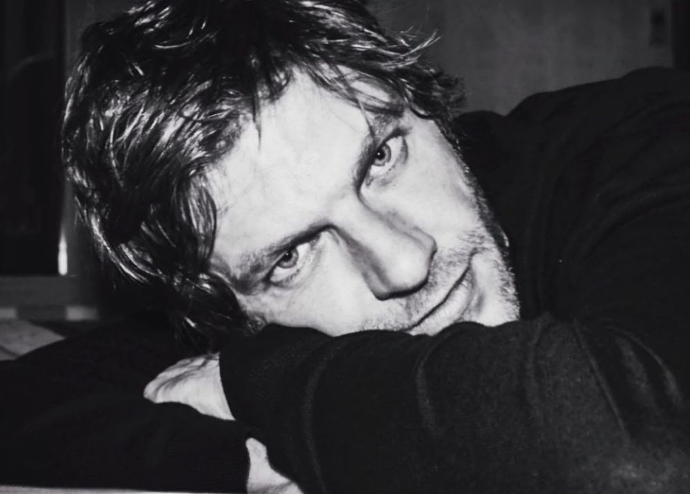 Black and white photo of Sam Hazeldine.