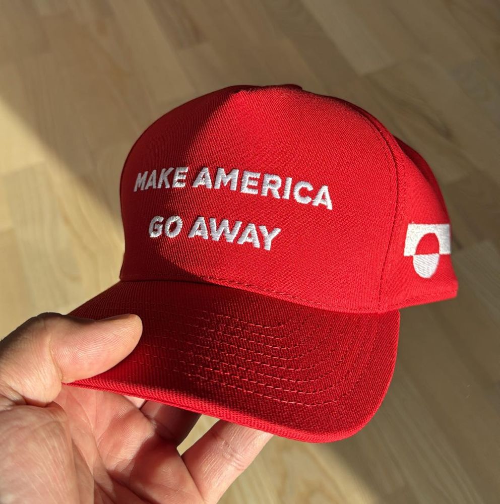 Red cap with the text Make America Go Away and the flag of Greenland