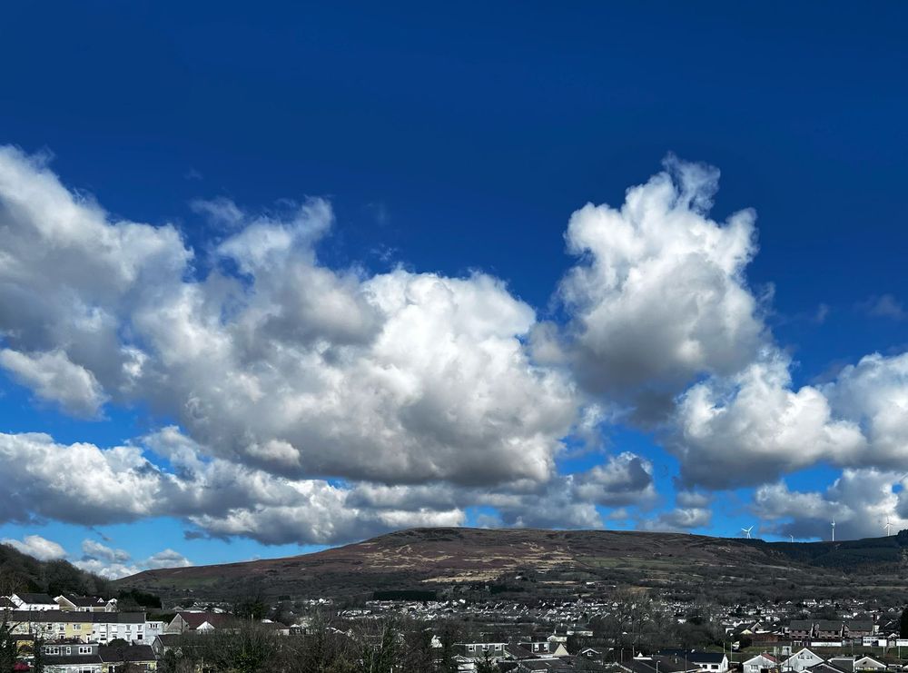 Blue skies over a Welsh valley