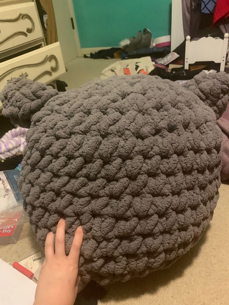 Very large grey fluffy crocheted stuffed animal with ears