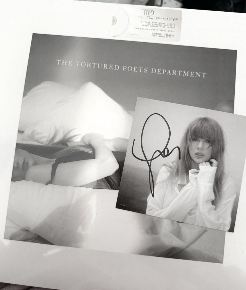 Tortured poets department vinyl cover with a signed image of Taylor Swift 