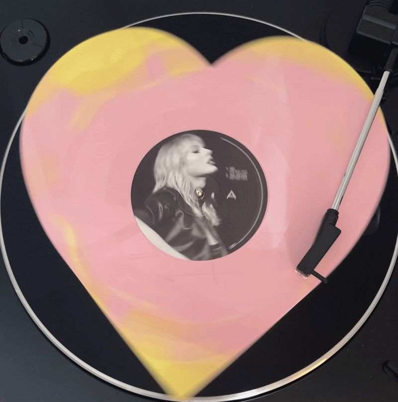 Pink and yellow heart shaped vinyl spinning 