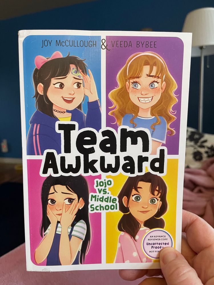 Cover of Team Awkward book 1. Shows a grid of 4 illustrated 6th grade girls with various embarrassed expressions on their faces. 