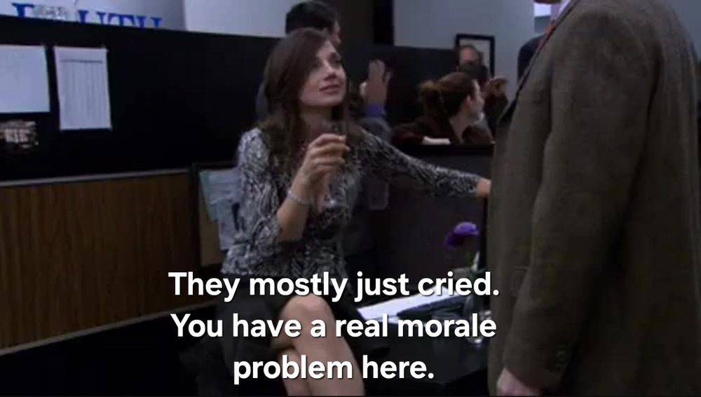 Woman holding a glass of wine. Text reading "They mostly just cried. You have a real morale problem here."