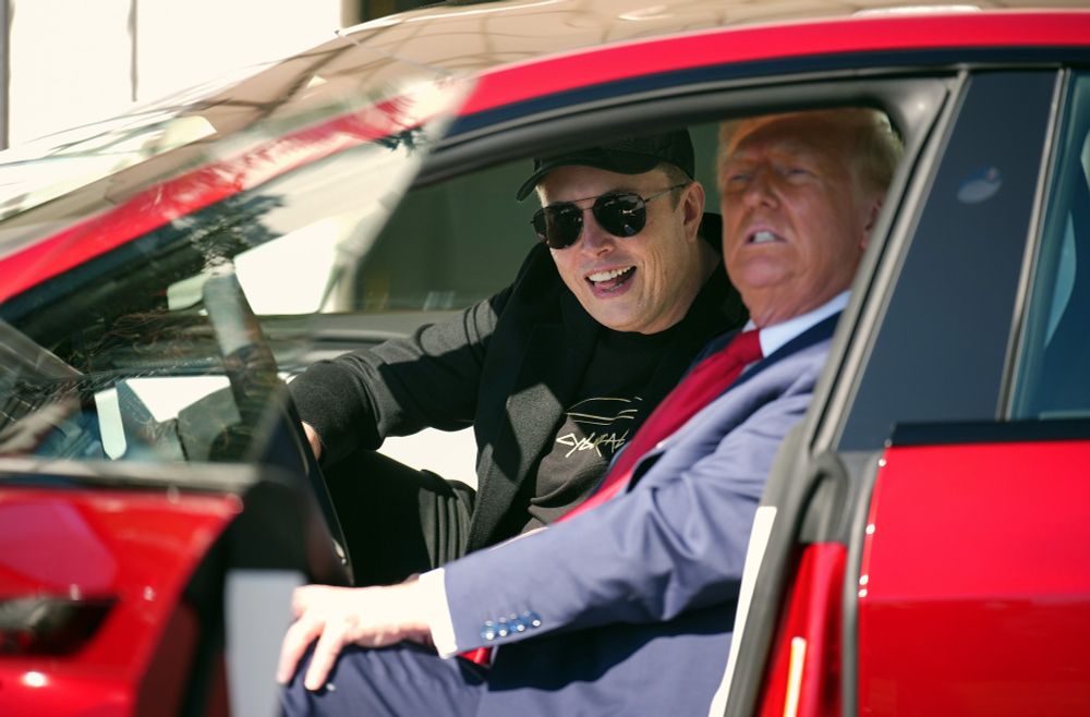 Trump and Musk crammed into the front of a Tesla.