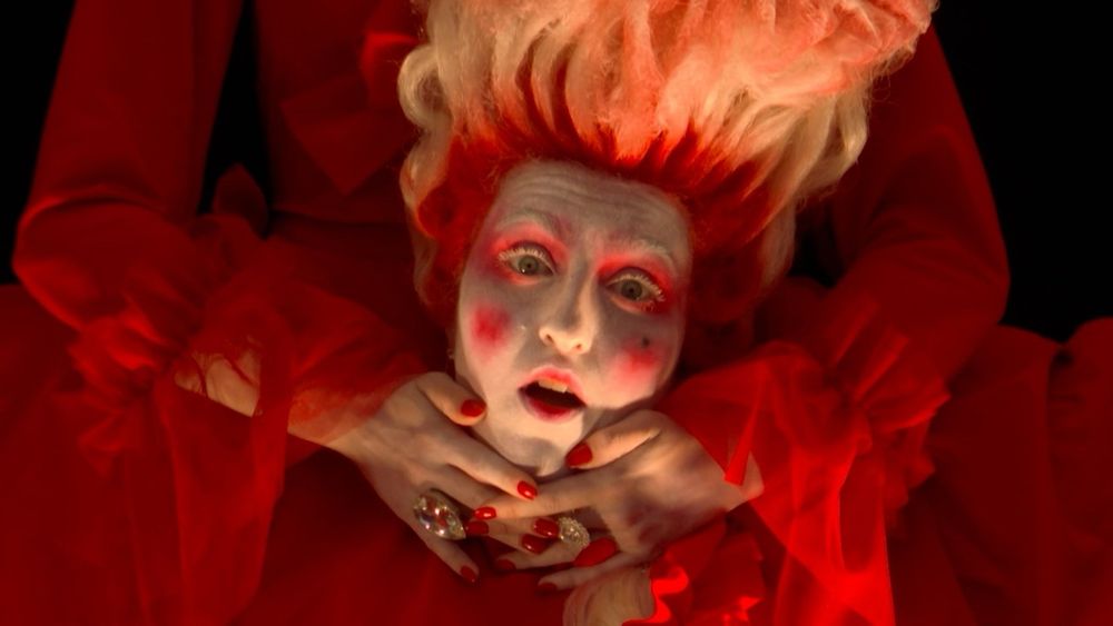 Headless Mary Antionette with flame hair from Gojira’s set during Paris Olympics’ opening ceremony