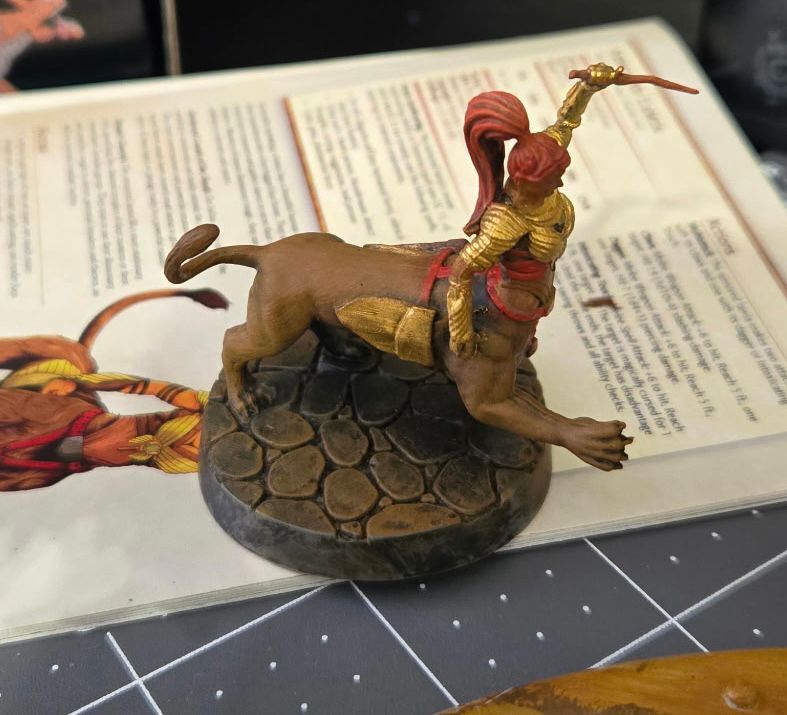 Centaur like warrior with gold and red armor