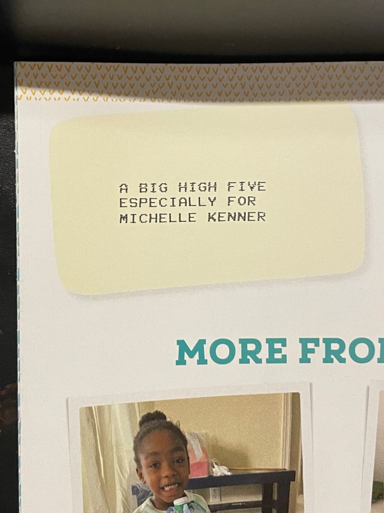 Photograph of the top left of the rear cover of the writer’s contributor’s copy of the magazine, which is printed with the custom message “A BIG HIGH FIVE ESPECIALLY FOR MICHELLE KENNER”