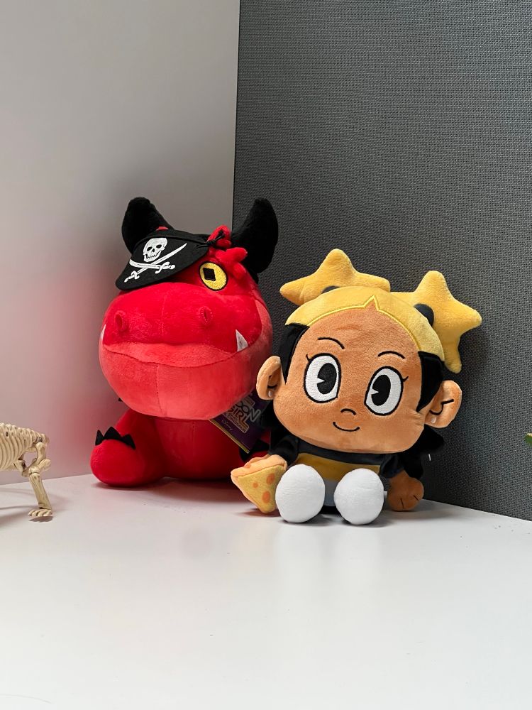 plushie of aika from i dont want to be a magical girl next to a plushie of devil dinosaur