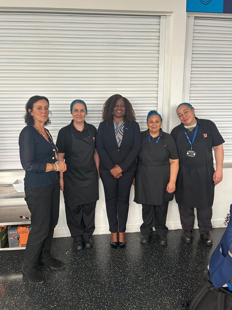 Marsha with lunch servers and Wandsworth Council cabinet member at St John Bosco