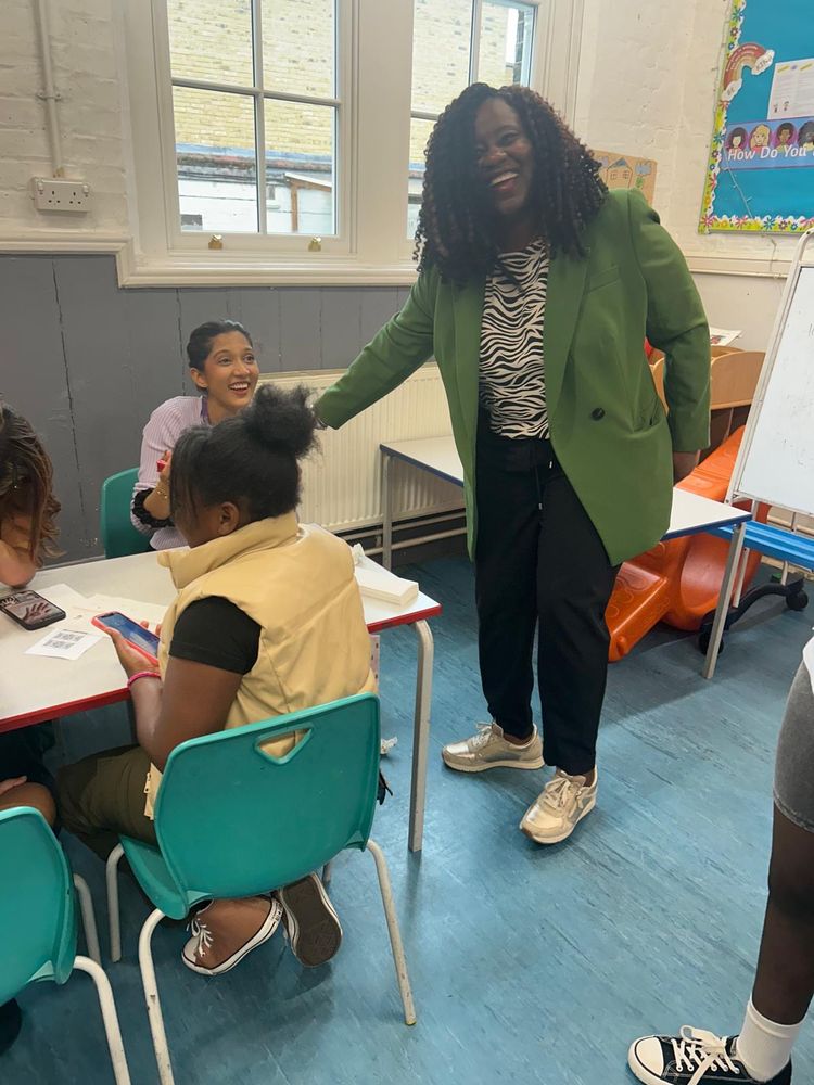 Marsha laughing with a member of staff