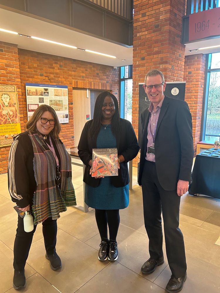 Marsha with two members of staff at the library (one woman, one man)