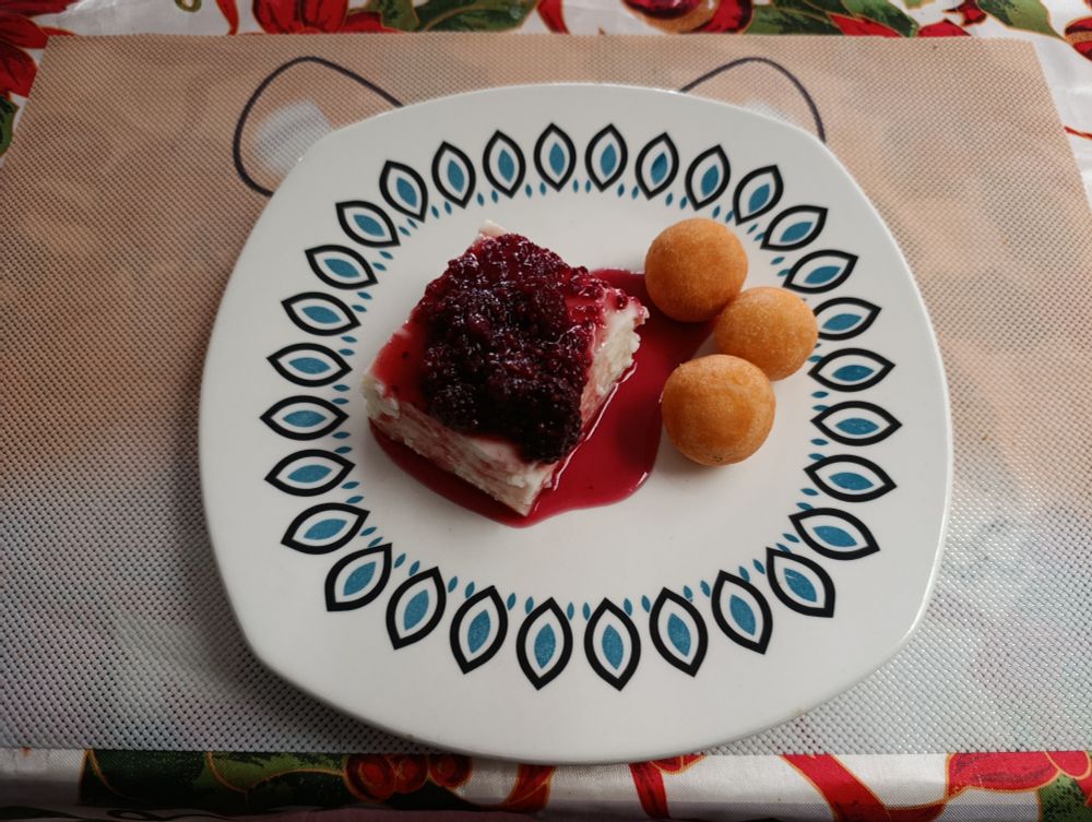 Coconut custard with blackberry jam and fritters