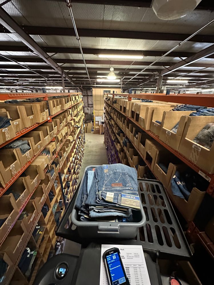 photo of a warehouse from the top down perspective from an e picker device