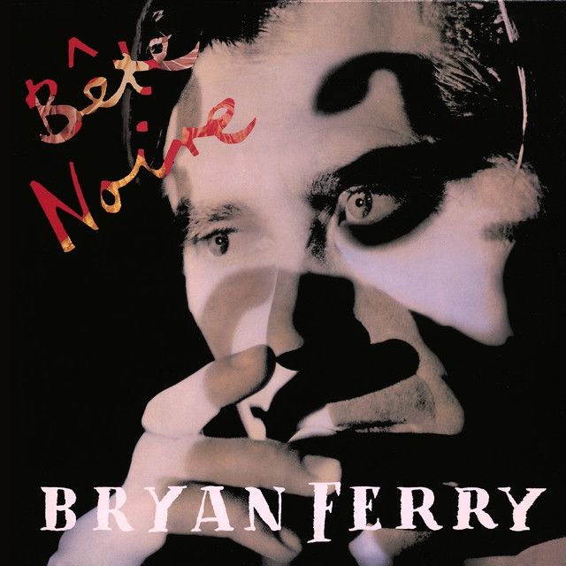 The album title, Bête Noire is written in red and gold, the image is dark and features a close up of singer Bryan Ferry's face. 