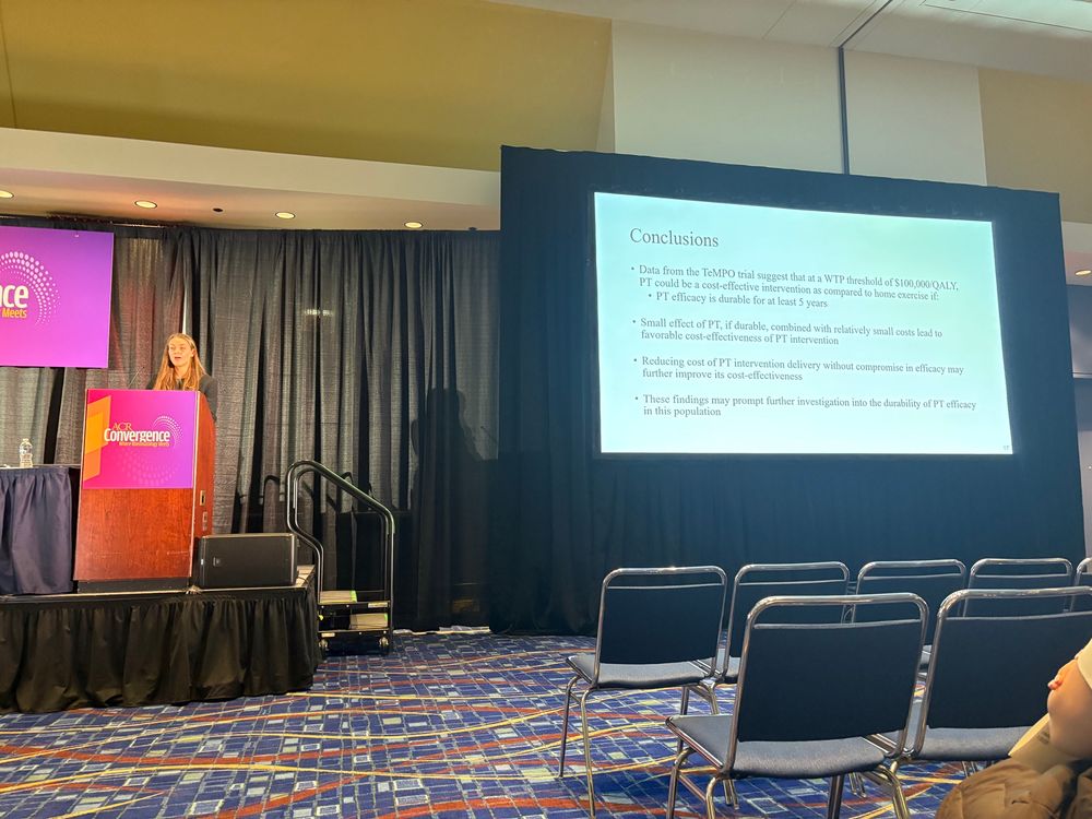 Sasha at the podium presenting her work 