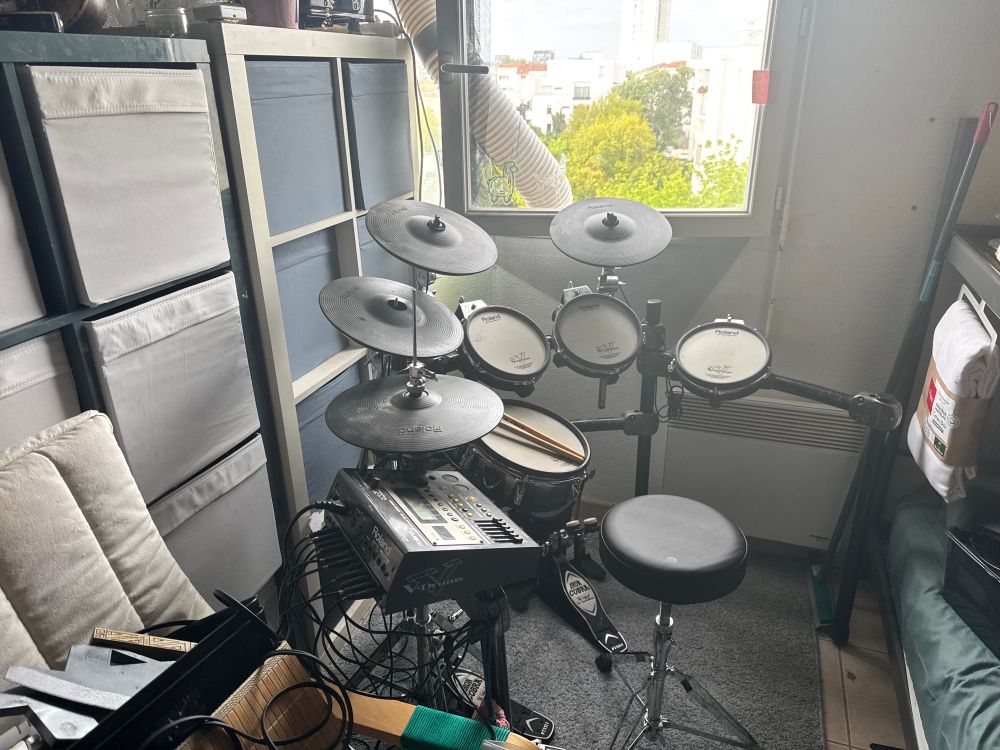 Old Roland TD-12K setup in my room for band practice. The drumset has seen better days.