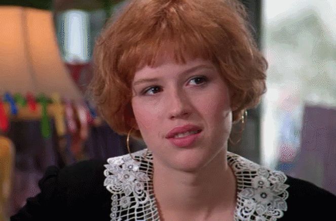 Andie in Pretty In Pink, black dress, smiling.