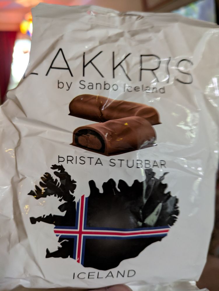 Bag of candy called Lakkris. A white plastic bag with pictures of the candy and the island of Iceland on the package.