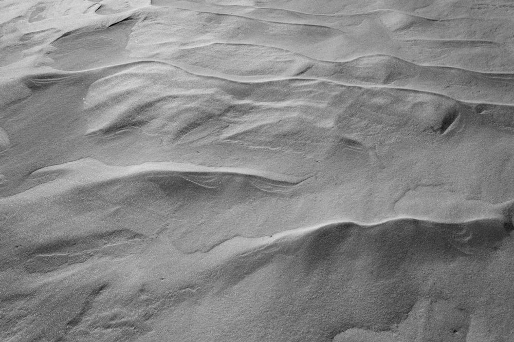 Snow texture photograph in black and white. Fuji neopan. 