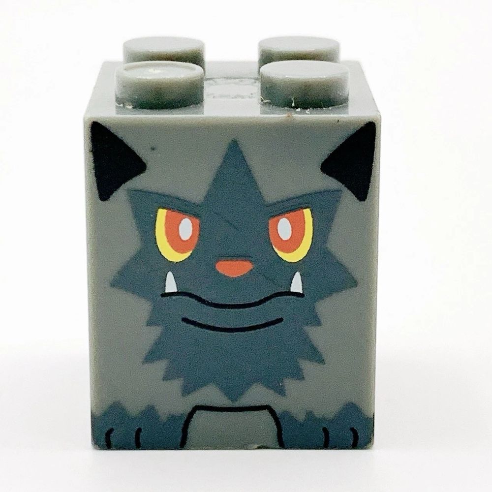 A Mega Block Poochyena. It looks like a grey 2x2 double-height LEGO brick with a poochyena on the side.