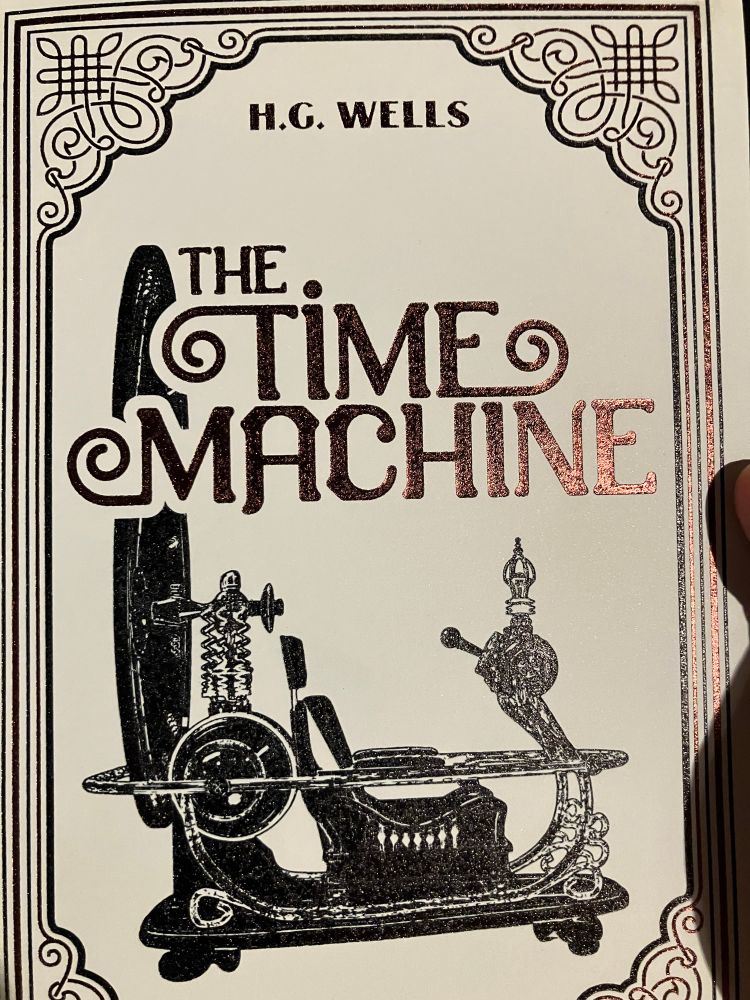 cover of HG Wells "The Time Machine" with a black and white steampunky contraption