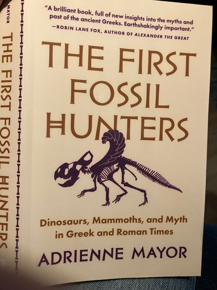 The First Fossil Hunters: Dinosaurs, Mammoths, and Myth in Greek and Roman Times. By Adrienne Mayor. Paperback cover with a stylized griffin skeleton