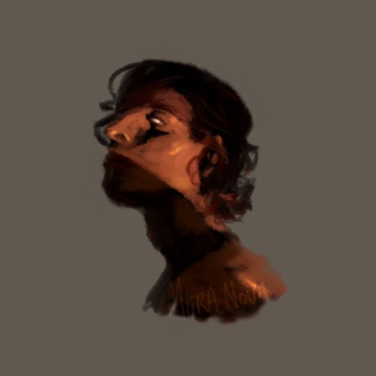 A portrait of a man, shadow covers the bottom half of their face.