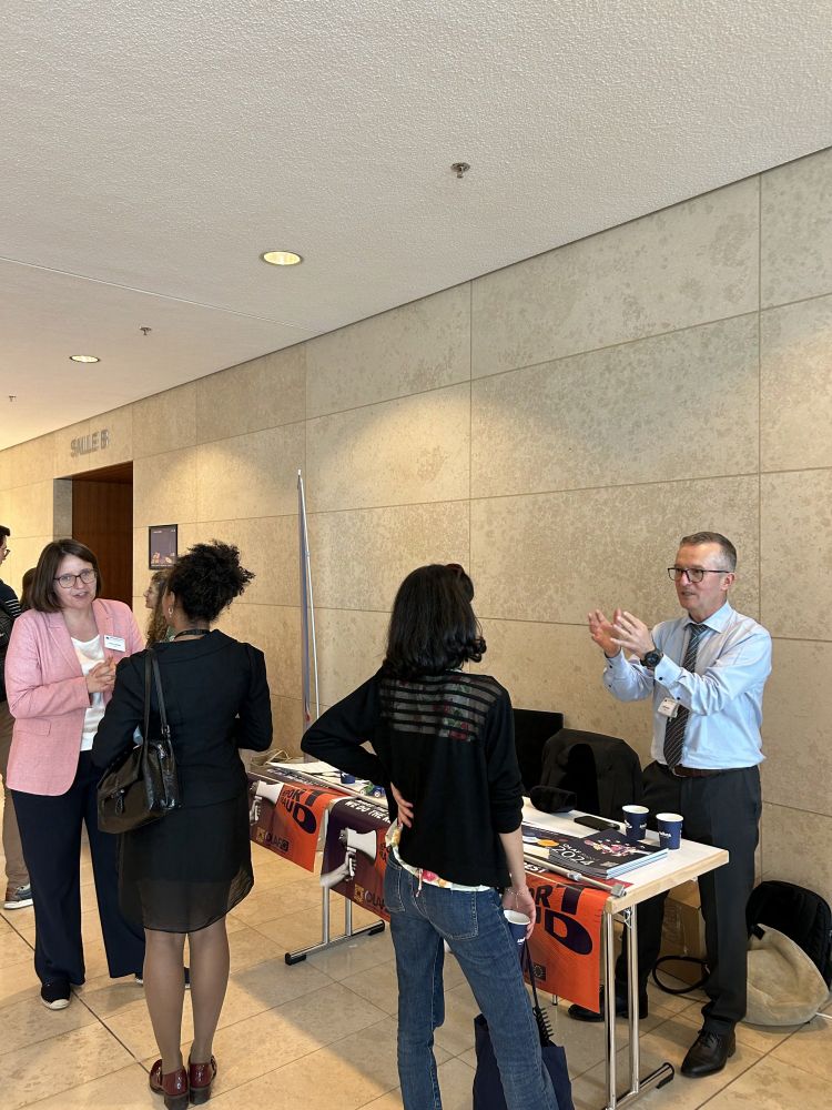 Representatives of OLAF talk with visitors to the Interinstitutional Job Fair.