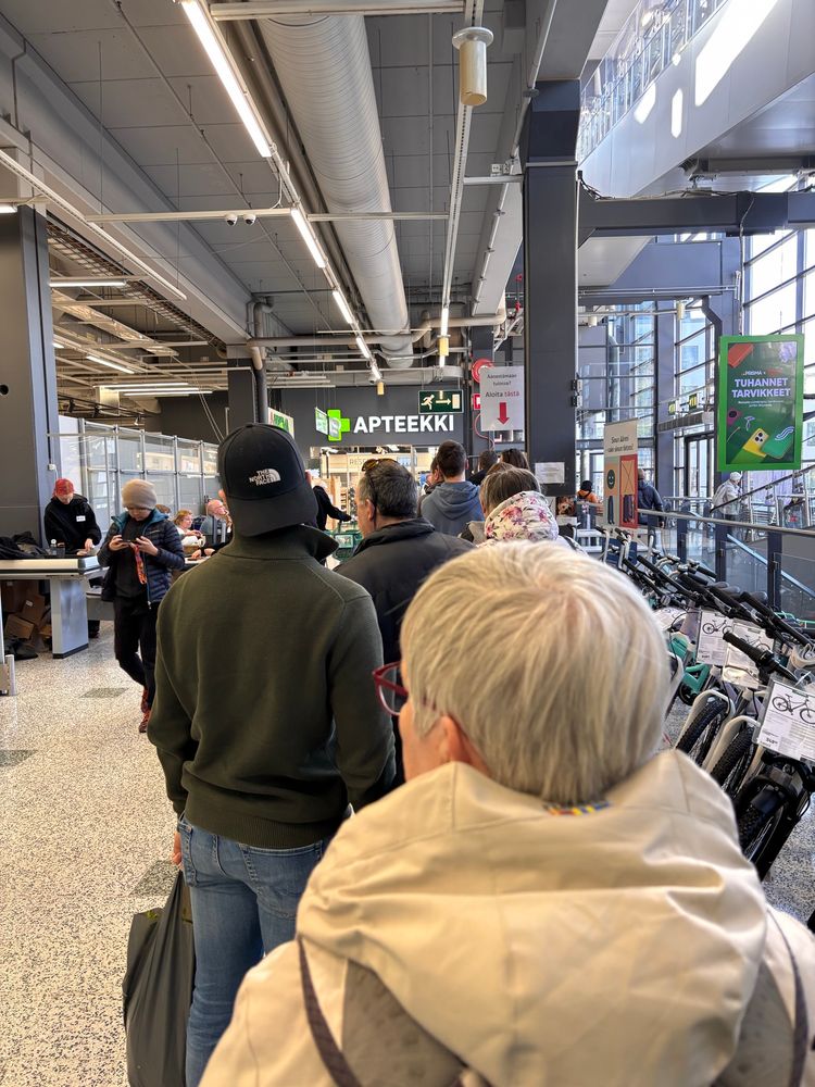 People queing to a voting station in a local supermarket. 