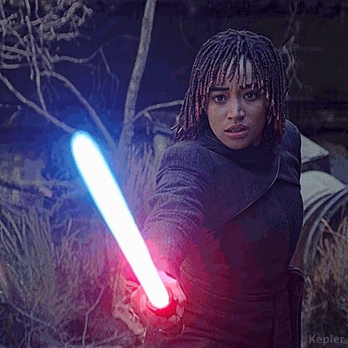 a woman with dreadlocks is holding a light saber with the word kepler on the bottom right