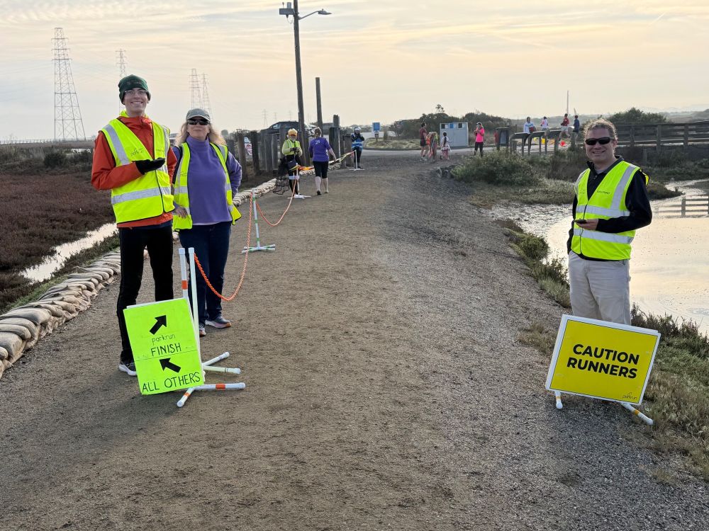 The nearly frostbitten finish line team hoping to see turkey-based costumes!