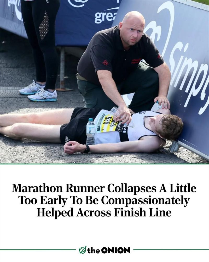 Marathon Runner Collapses A Little Too Early To Be Compassionately Helped Across Finish Line 