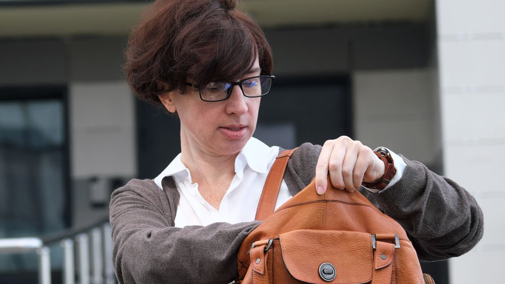 Woman Reaches Arm Deep Into Purse Like Farmer Artificially Inseminating Cow