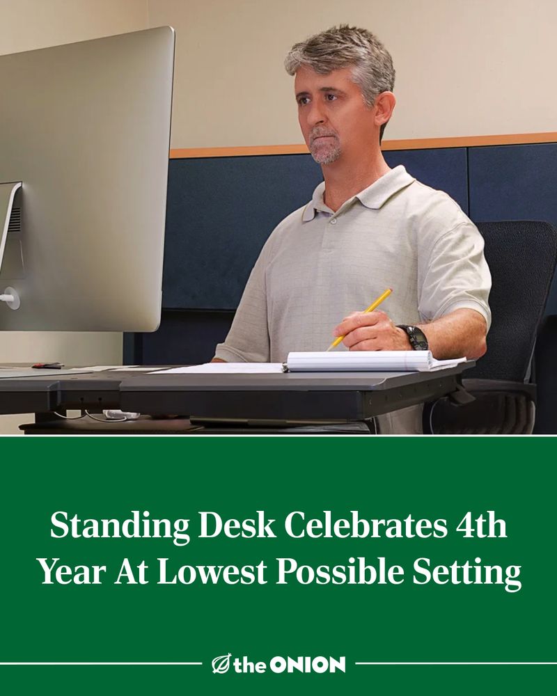 Standing Desk Celebrates 4th Year At Lowest Possible Setting

-The Onion