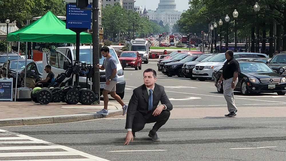 ‘Still Fresh,’ Says Crouching Pete Buttigieg Swiping Finger Across Tire Tracks On Street