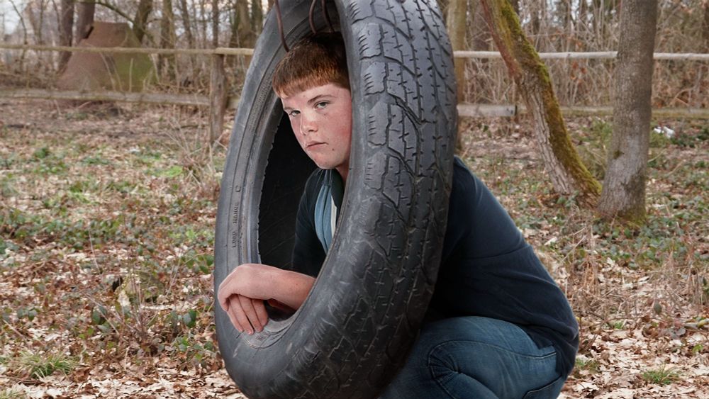 High School Quarterback Using Tire Swing To Practice Putting Head Through CT Scanner