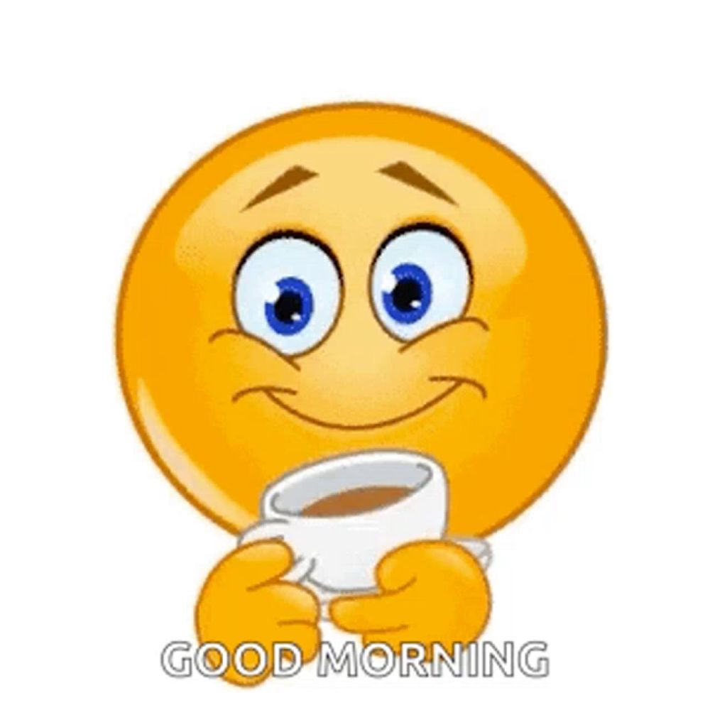 a smiley face is holding a cup of coffee and smiling .