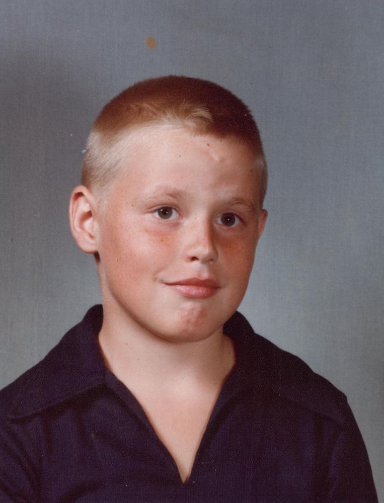 Russ in 1977, a white boy with a buzz cut.