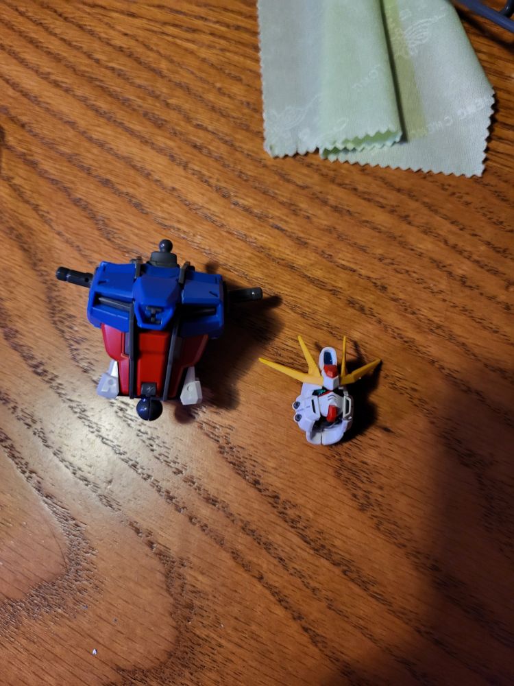 An assembled Gundam head and body