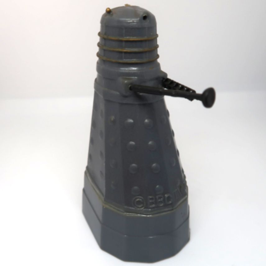 An ultra rare Dalek pencil sharpener, As Featured in BBC Television Doctor Who, circa 1965, in good condition for its age. However, the eye stalk is missing and one of the Dalek top light /ear is missing. Extremely rare, not many have survived. The Dalek measures about 7.5 cm's tall.
