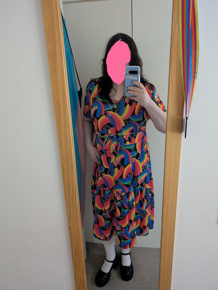 me in a rainbow dress with white tights and black shoes