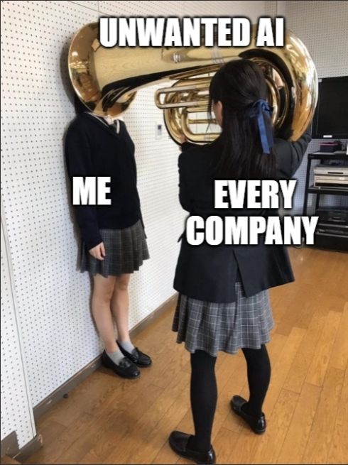 Two schools girls, one holding a tuba with the open  aperture over the head of the other, horizontally, implying an imminent blast of sound.