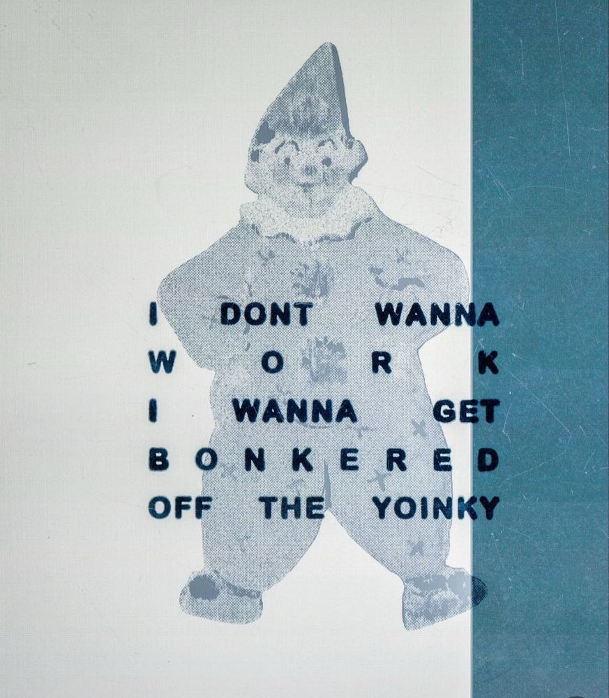 An old-style book cover with a picture of a clown doll and text overlaid that states; "I don't wanna work, I wanna get bonkered off the yoinky".