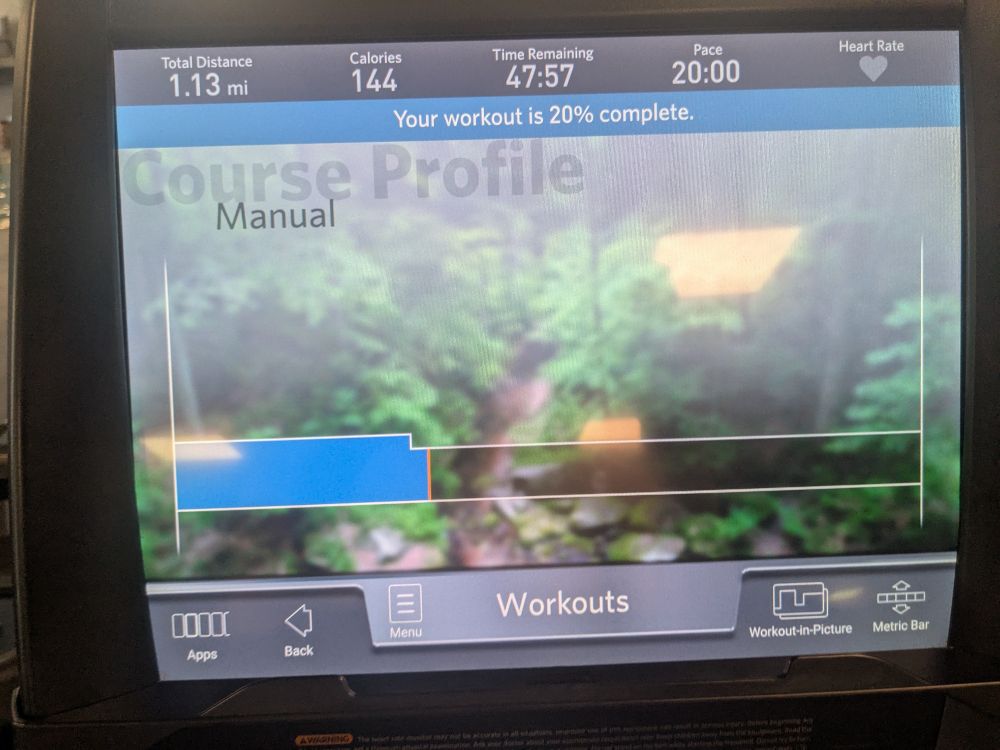 A picture of a treadmill screen. It shows I was able to run a mile after a .10 mile warm up.