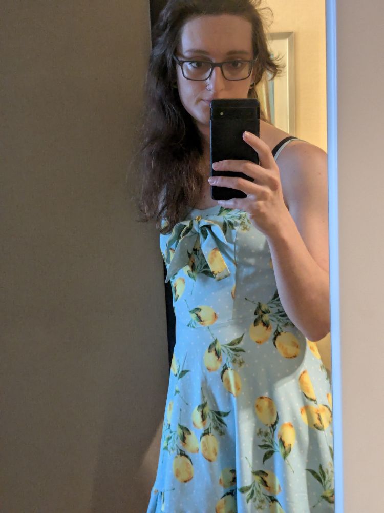 Me in a blue dress. The dress is sky blue with lemons all over and a small bow on the front. 