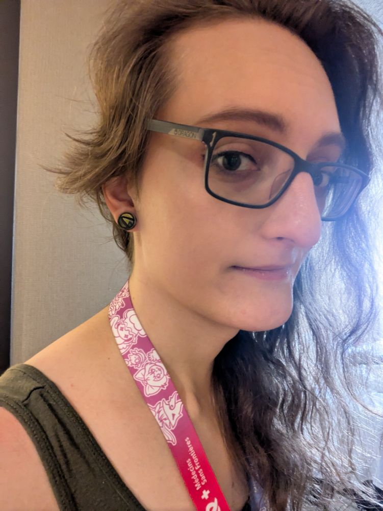 It me. My messy, brown hair is long on one side, and growing back out on the close side. I have my gdq badge on and new vault symbol earrings from borderlands on my ears
