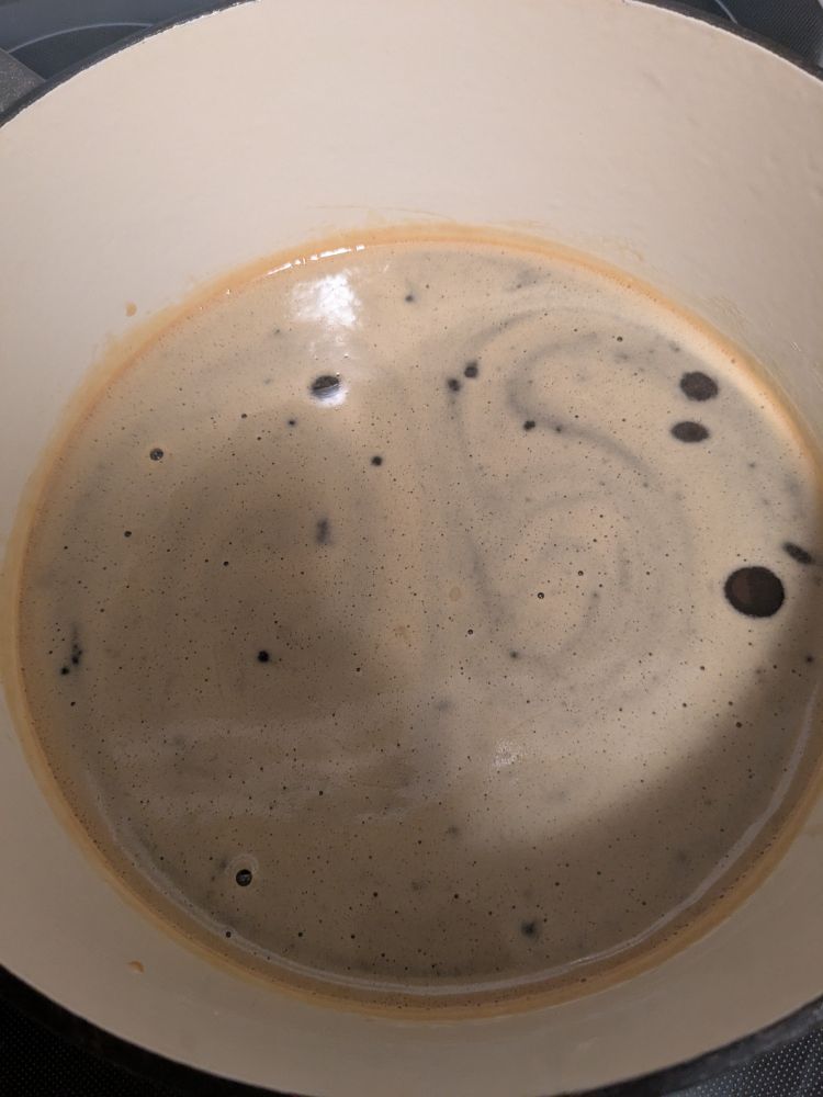 A pot of very slowly cooking honey. The pictures do not give this justice on how it smells. The pot is slightly full of a foamy, dark amber liquid bubbling every so often
