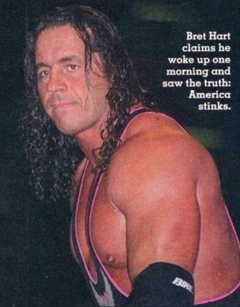 bret hart looking very serious with the text, "bret hart claims he woke up one morning and saw the truth: america stinks."